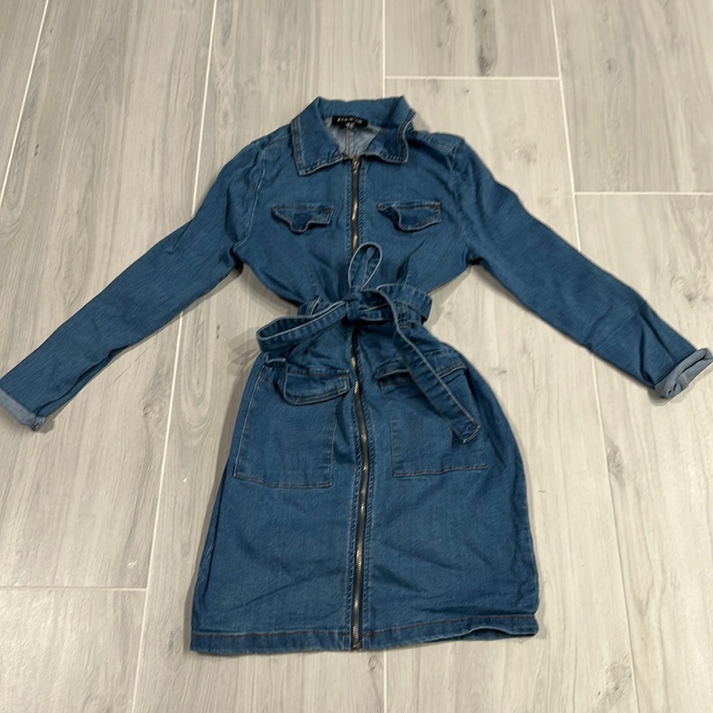 It is a women’s denim dress size 8
